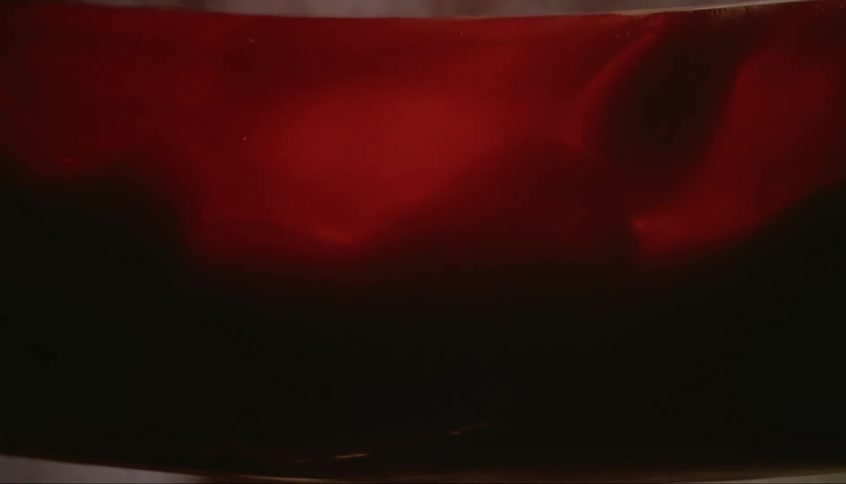 A tube section fills with a dark red liquid