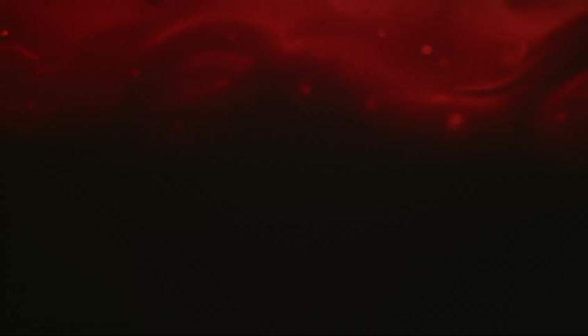 Crimson and black liquids and vapors flow and swirl