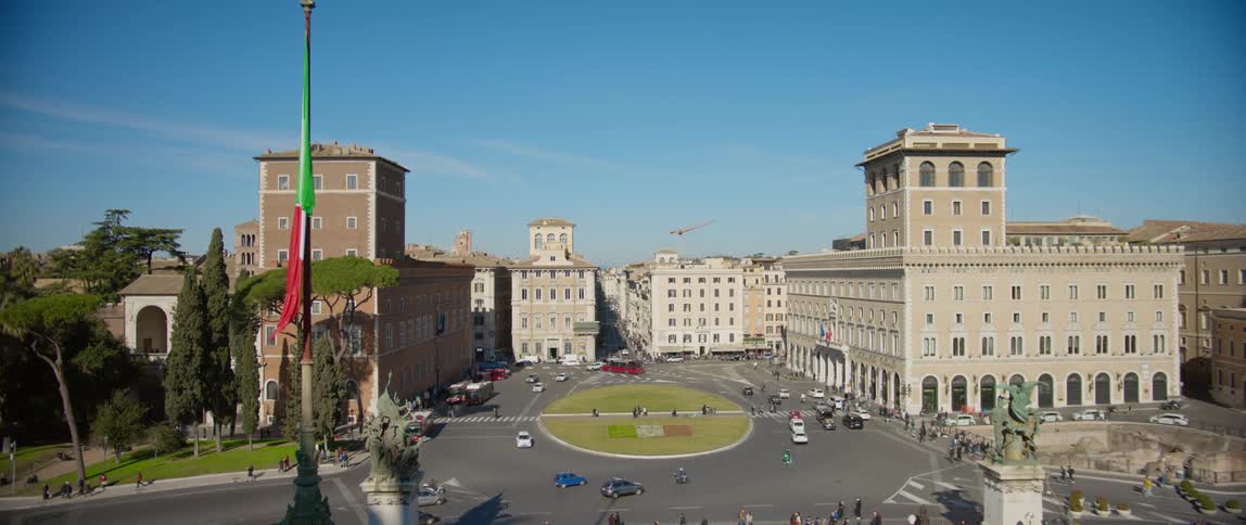 A view of a city with cars driving around