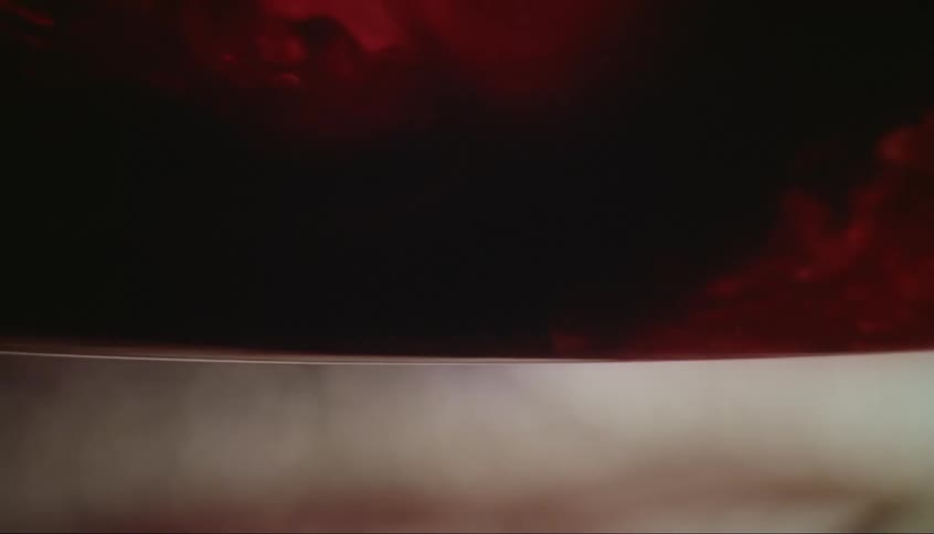 Red liquid is flowing in a medical tube