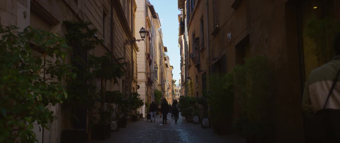 People walk down the alley in the city