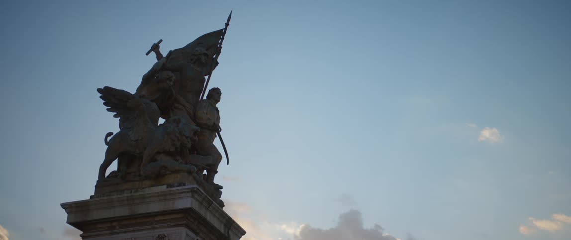 A sculpture of warriors on a column in rome