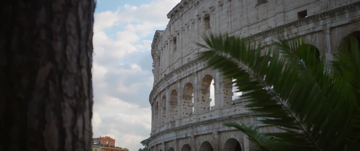 Exterior facade of the ruins of the colosseum amphitheatre in the city of rome at morning