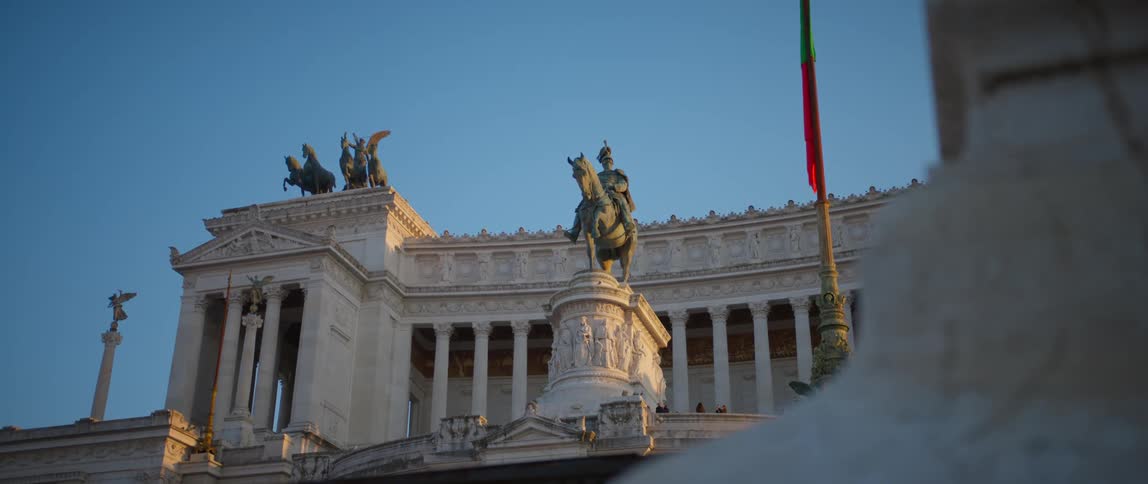 Monuments and statues are displayed near a building