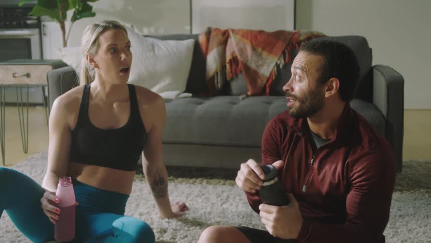 Man and woman are talking and drinking water together