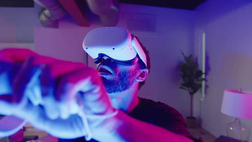 A man puts on his virtual reality headset
