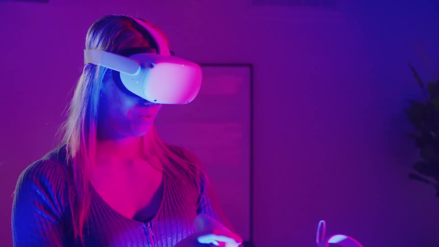 A woman is using virtual reality at home