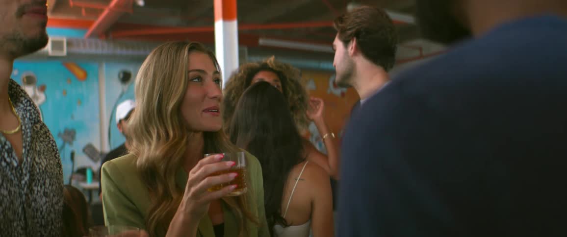 Friends standing together at party share a toast