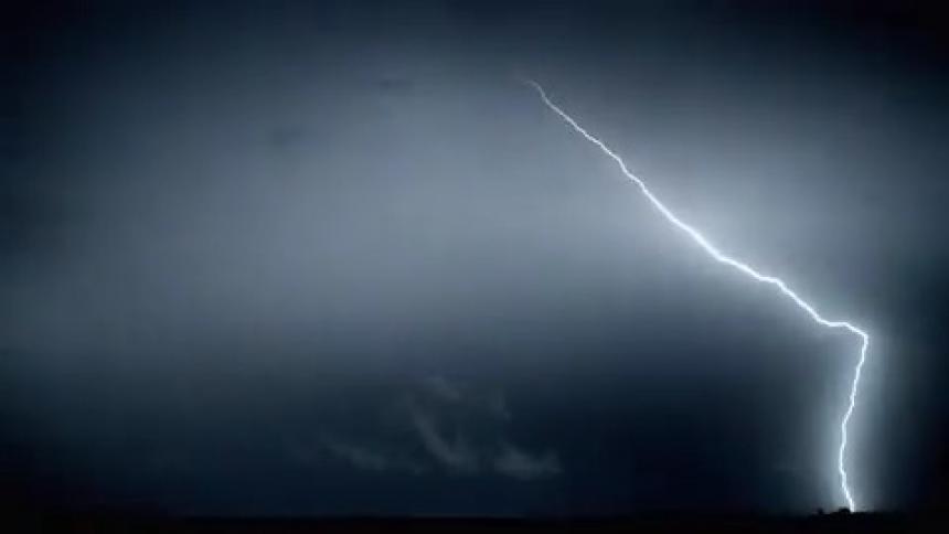 Lightning bolts is flashing in the sky during a storm