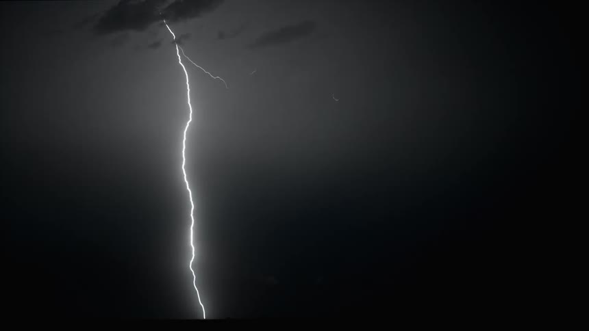 Flashes of lightning across the night sky
