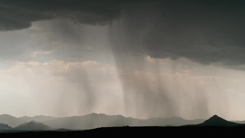 A landscape view of storm clouds and lightning