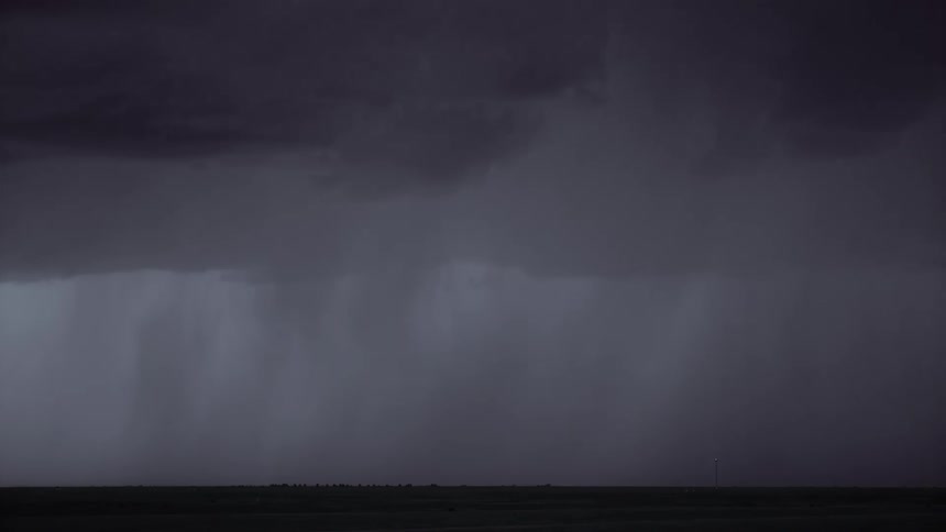 Rain is pouring as lightning flashes