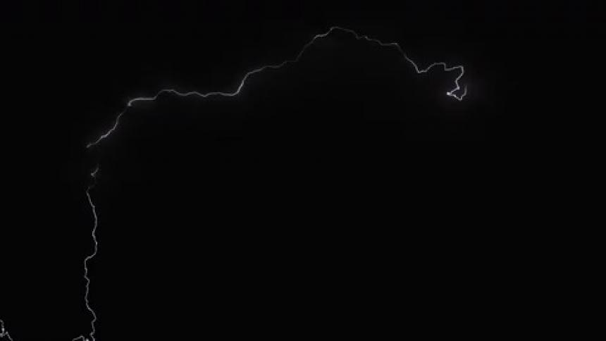Lightning flashing in a dark night sky during a thunderstorm