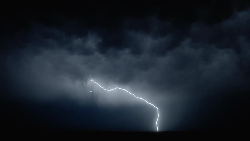 Lightning is flashing during the storm at night