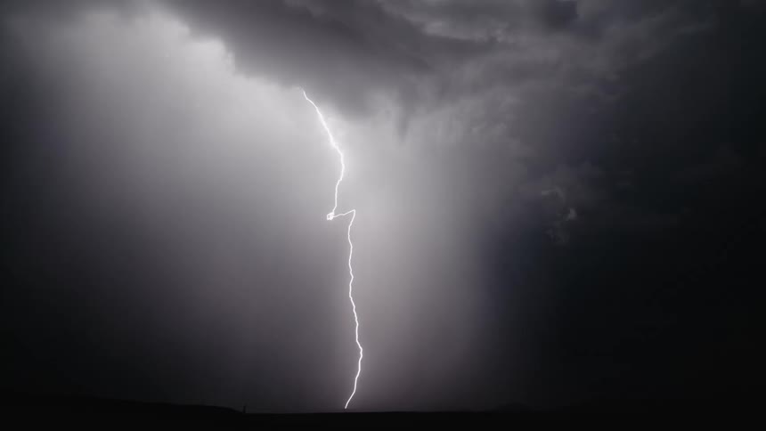 Lightning from a storm is displayed at night