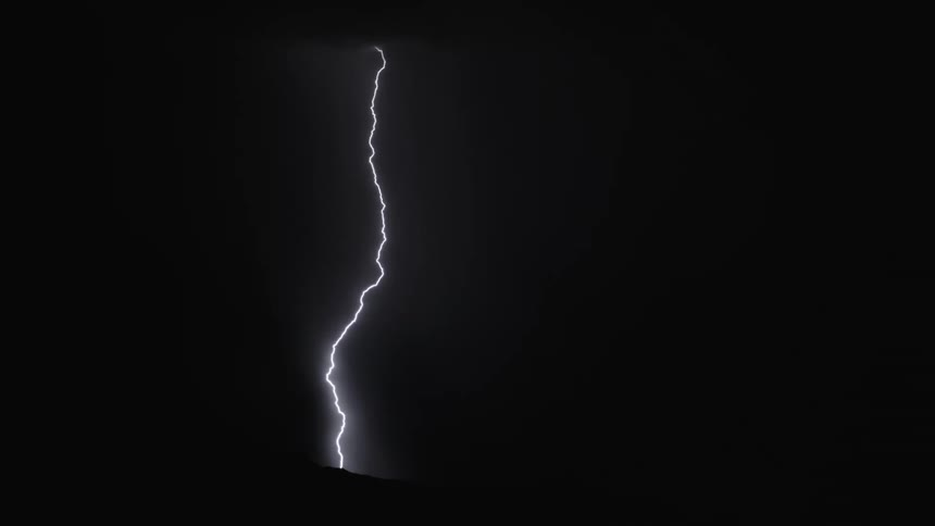Lighting forks out as it strikes in the night sky