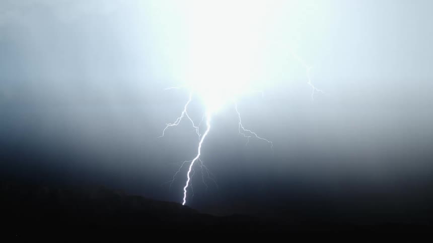 Lightning flashes in the dark sky