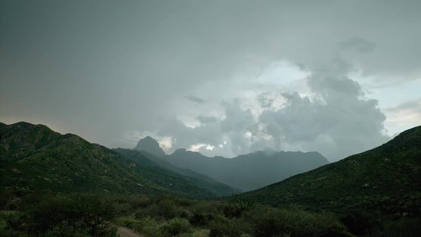 Its storming in a mountainous area during the day