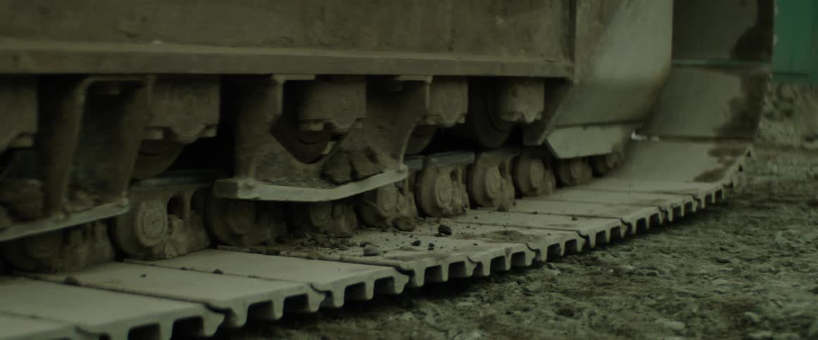 A bulldozer rolls through a construction site