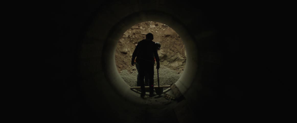 Construction workers digging