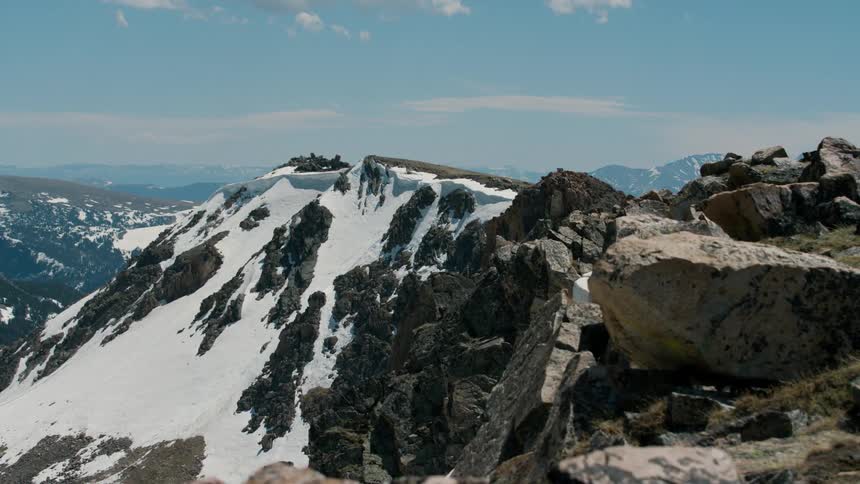 A snowy mountain range in the wilderness on a winter day