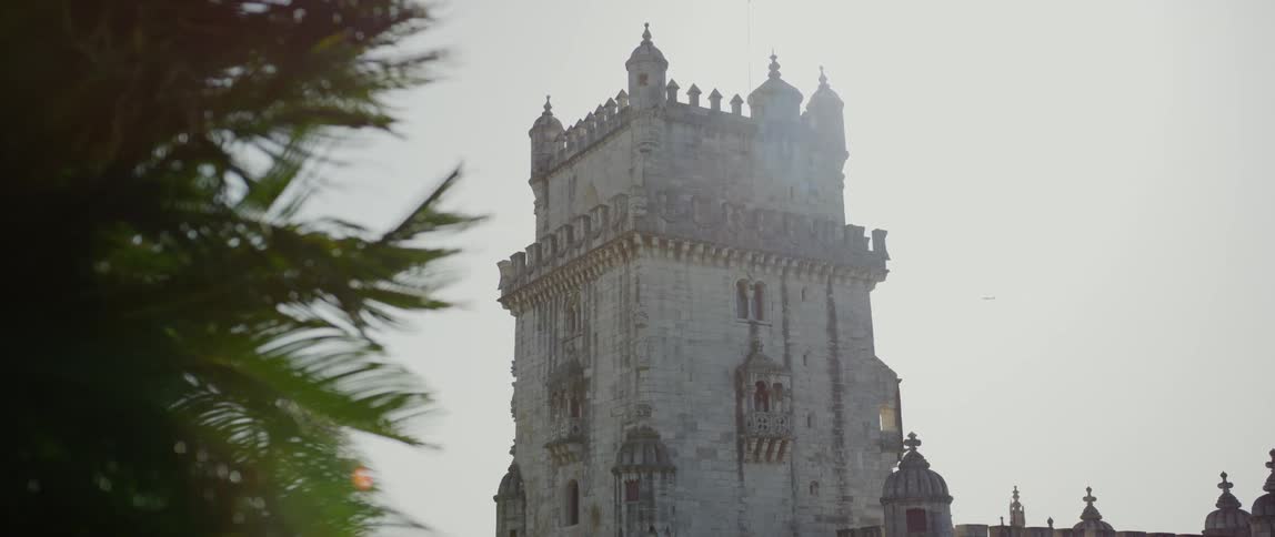 A white architectural castle against a clear sky