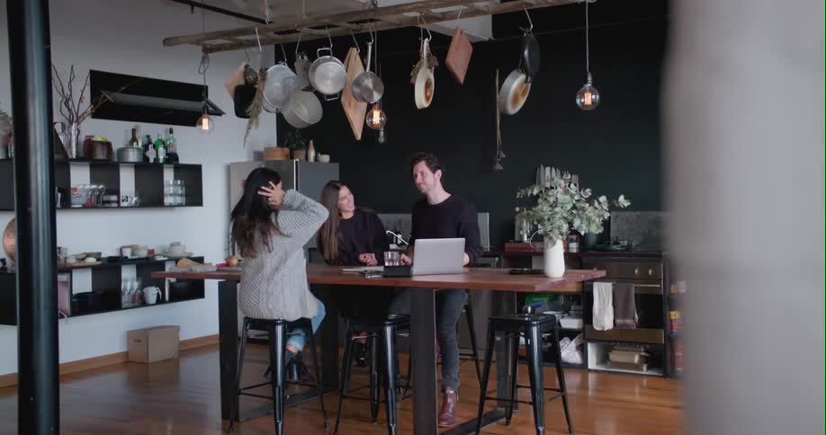 A trio of people in the kitchen