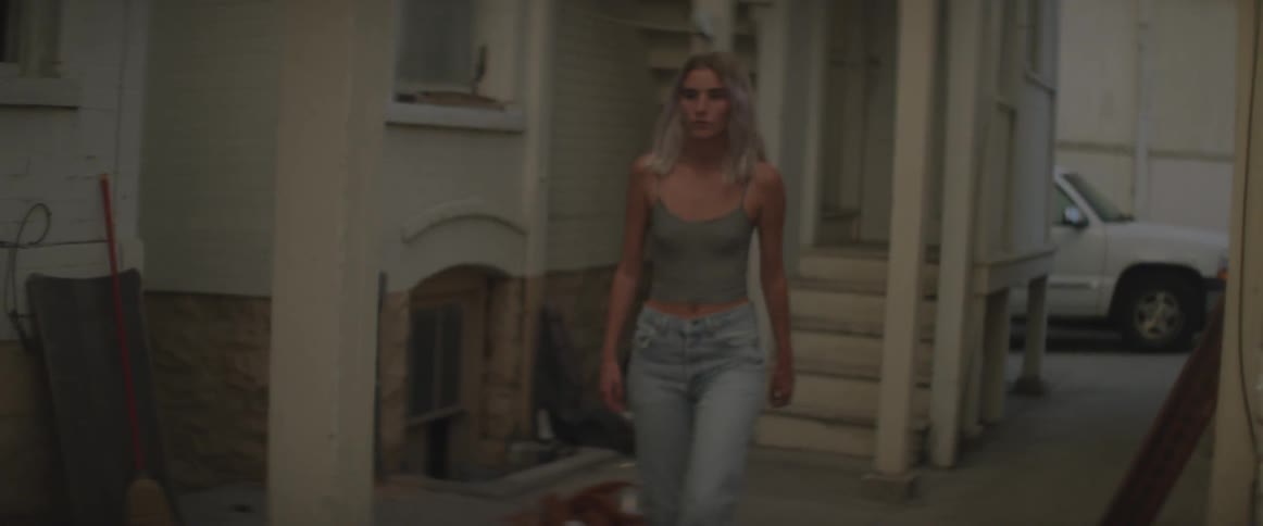 Woman walks out of a building