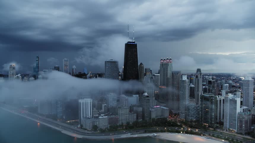 A view of a Chicago with fog around it
