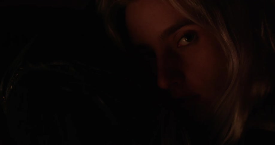 Woman's face in dim light