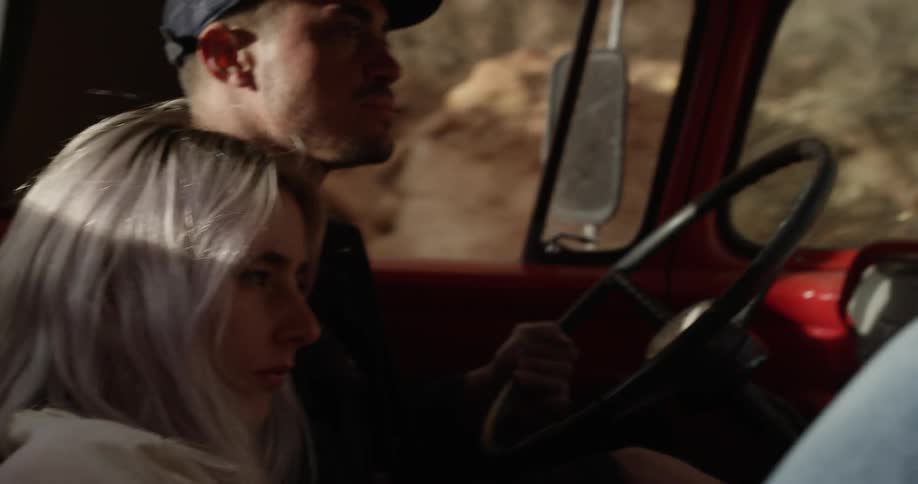 Man driving in a truck with a woman