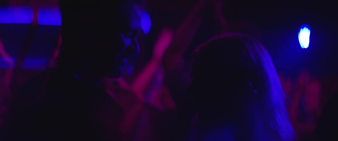 People dancing in a dark club
