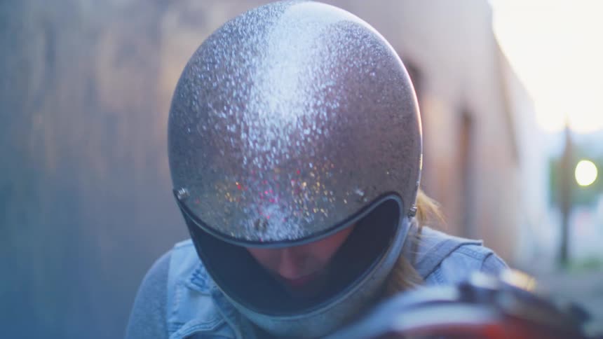 A view of a woman on a motorcycle