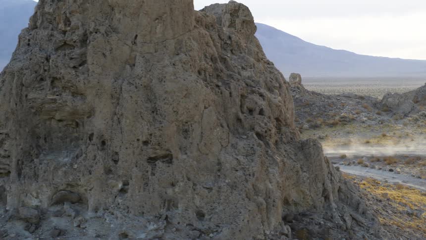 Two people are riding their dirt bikes in the desert