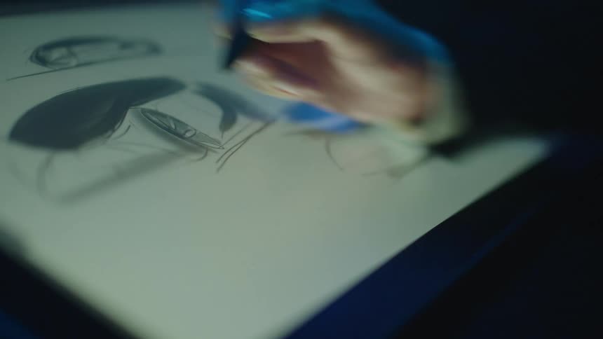 A person is drawing on a tablet screen