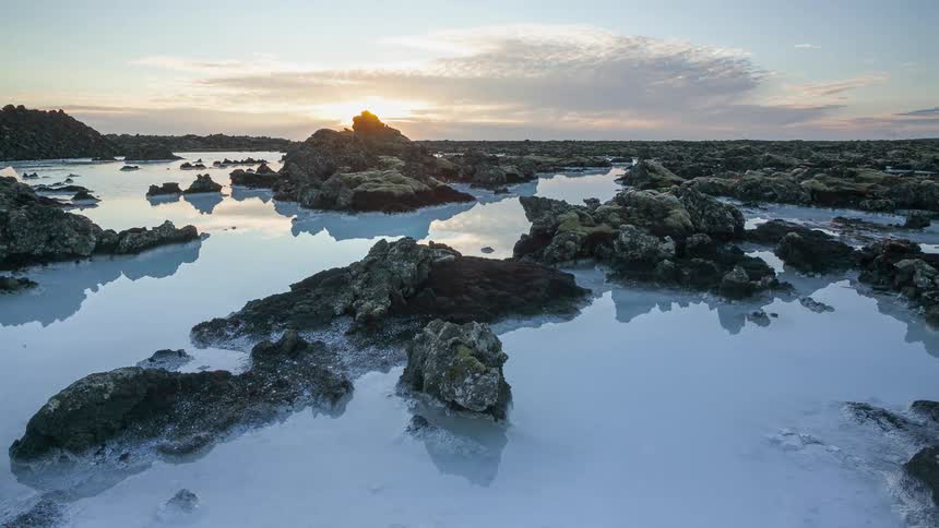 Aerial view of water near the coast at dusk