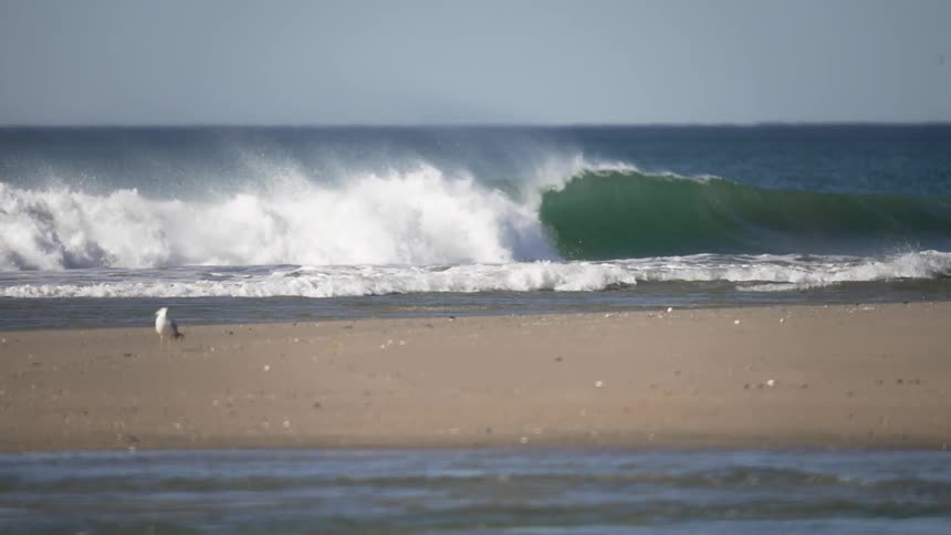 A view of waves crashing on the shore