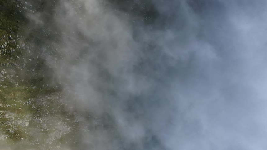 Aerial view of field below the clouds