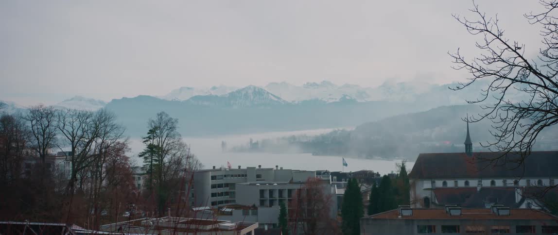 Fog covers the water by the town
