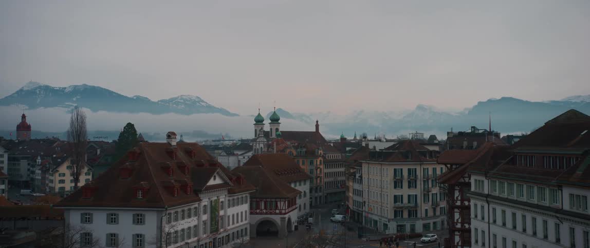 Skyline of the buildings in the city of bern in switzerland close to the mountains at evening