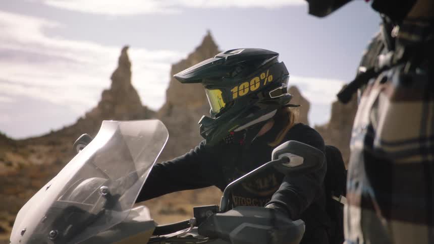 Two people out in the desert on dirt bikes