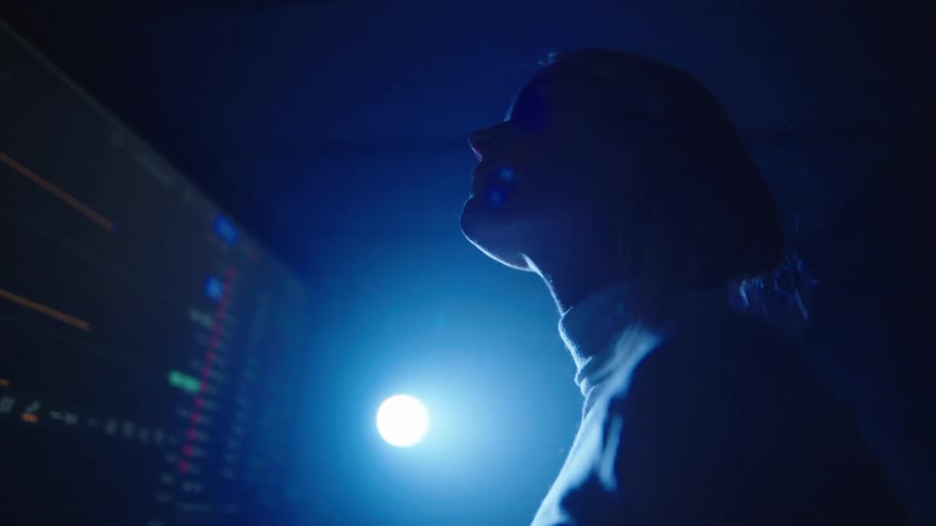 Two workers looking at a screen
