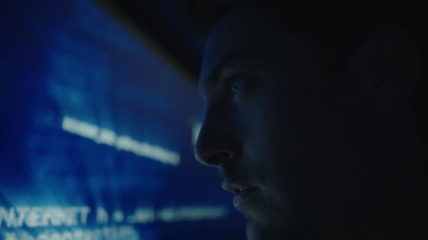 A view of a person looking at a screen