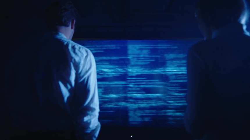Two people looking at a computer screen