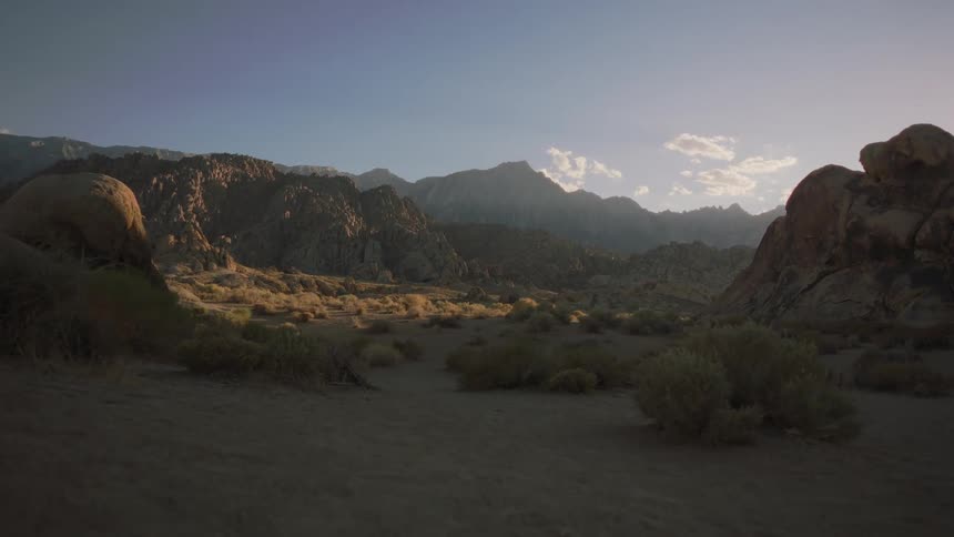 Mountains and valleys are displayed in an open landscape