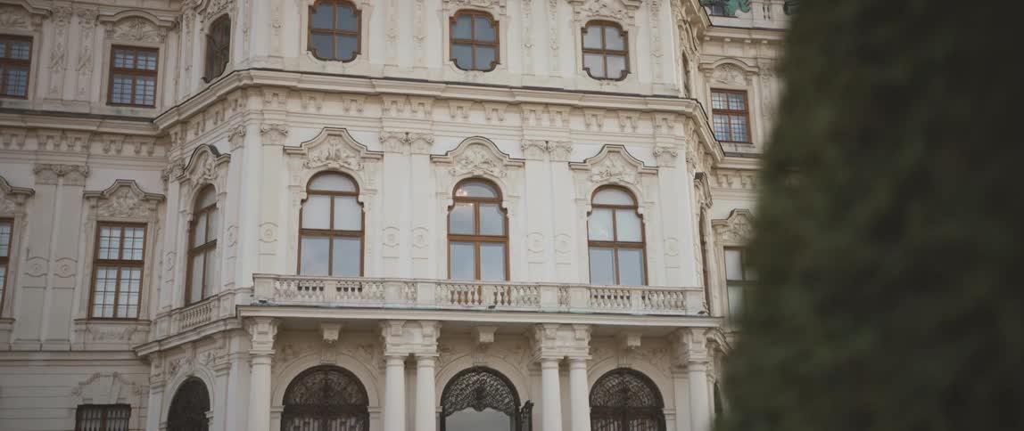 There are statues at the top of the building