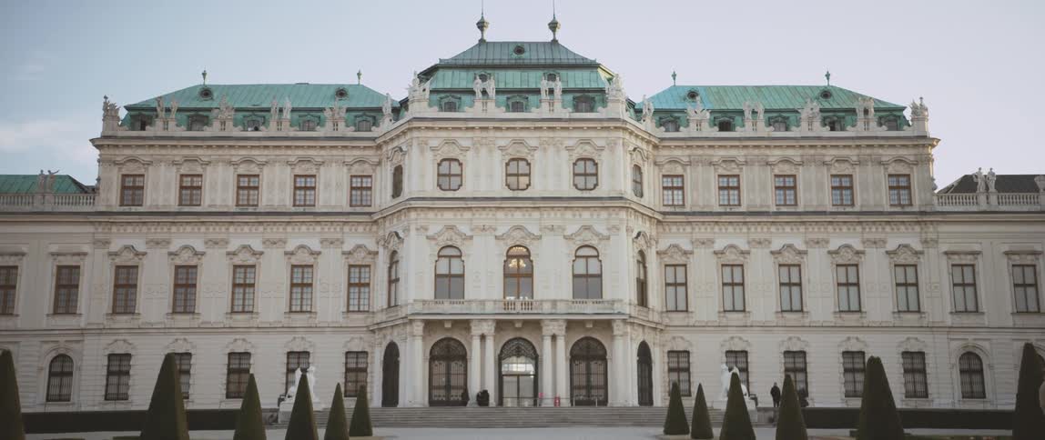 People walk on the grounds of the belvedere palace in austria