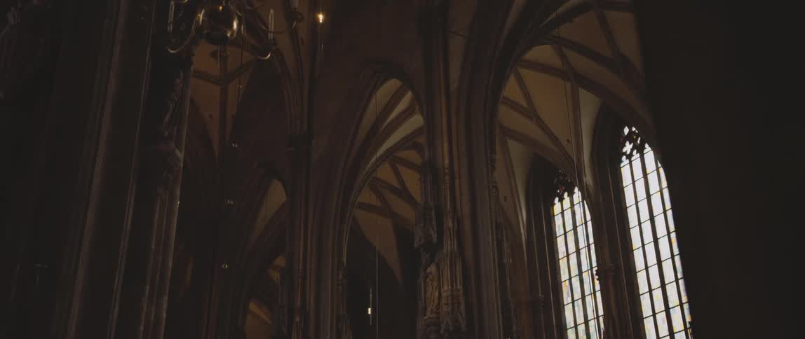 Pillars inside an elaborate designed cathedral during the day