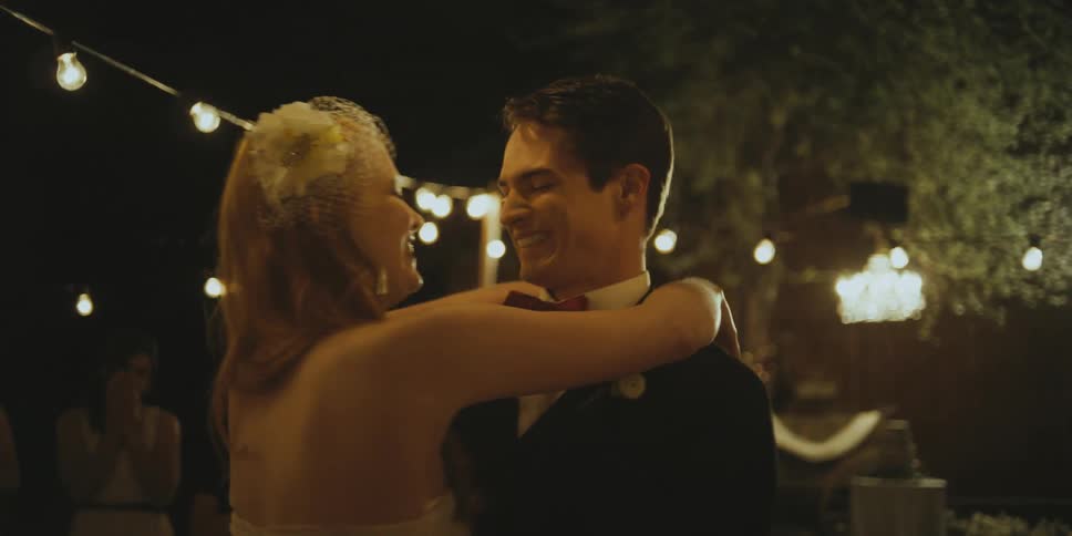 A bride and groom dance at their reception