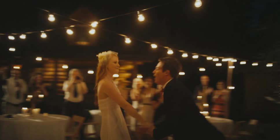 A bride and groom dance at their reception
